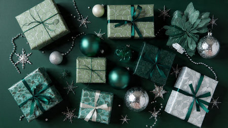 A clean and modern holiday border made of symmetrical green and silver decorations.の写真素材