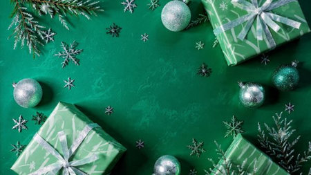 A sparkling Christmas border composed of bright silver stars and rich green baubles.の写真素材