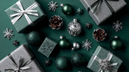 Holiday flat lay framed with emerald ornaments and high-shine silver accents.の写真素材