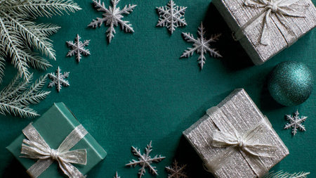 A luxurious Christmas border featuring deep green tones softened by silver accents.の写真素材