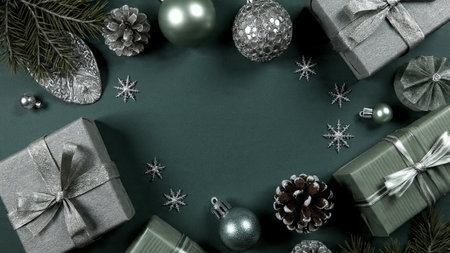 Elegant mockup featuring a velvety green background with luminous silver snowflakes around the edges.の写真素材