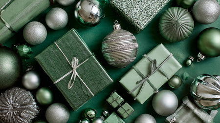 A minimalist mockup layout with matte green surface and lightly scattered silver snowflakes.の写真素材