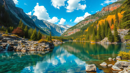 A peaceful riverside path lined with tall trees and soft grass.の写真素材