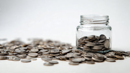 Clean savings concept showing a jar with coins forming a minimal triangular layout, commercial-safe.