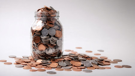 Clean wealth representation with a transparent jar resting behind three coin stacks,...