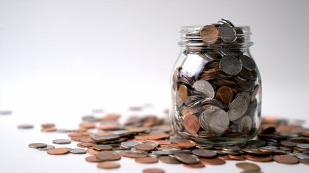 Bright financial planning scene with coins forming a soft pattern near a pristine glass jar,...