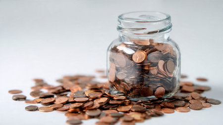 Clean savings concept showing a jar with coins forming a minimal triangular layout, commercial-safe.