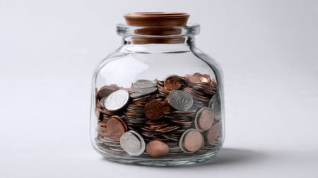 Minimalist investment layout showcasing coins arranged in rows near a clear jar, commercial-safe.