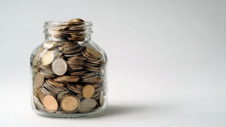 Clear jar representing savings placed near coins stacking upward symbolizing progression,...