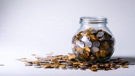 Clean wealth representation with a transparent jar resting behind three coin stacks,...