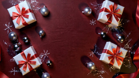 A cinematic holiday layout showing high-detail red bows and metallic dの写真素材