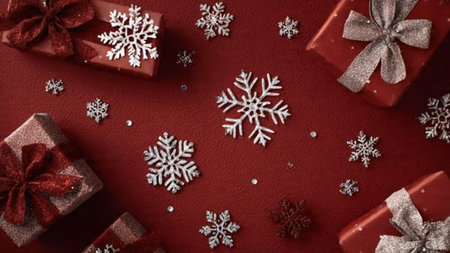 Frosted metallic decorations arranged on a dark navy canvas.の写真素材