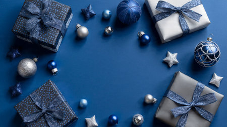 Minimalist Christmas mockup with evenly distributed silver decorations over deep blue.の写真素材