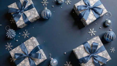 Clean holiday border featuring deep-blue gradients and high-polish metallic snowflakes.の写真素材