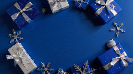 Classic blue-and-silver Christmas frame with gracefully aligned ornaments.の写真素材