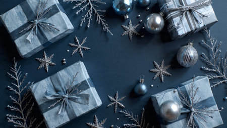 Modern festive top view featuring deep-blue matte textures and sparkling silver details.の写真素材