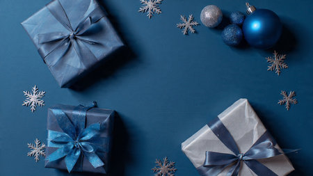 Vintage navy holiday spread with weathered silver accents and muted lighting.の写真素材
