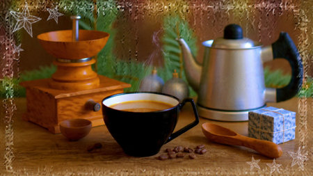 A wooden table decorated with evergreen foliage and warm winter coffee.の写真素材
