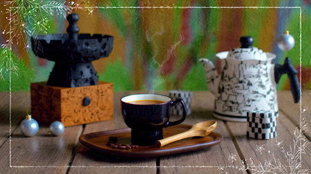 A warm steaming drink illuminated by soft winter morning rays.の写真素材