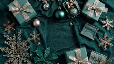Elegant Christmas scene featuring refined gold accents against a rich emerald base.の写真素材