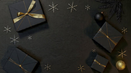 A gentle gold glow enhances a refined matte-black holiday setup.の写真素材