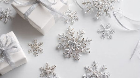 Christmas background. White gift boxes with silver snowflakes on white background. Flat lay, top view, copy spaceの写真素材