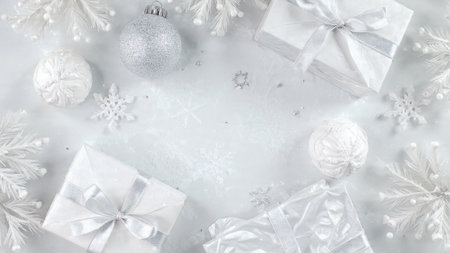 Christmas background. White gift boxes, silver balls and white snowflakes on white background. Flat lay, top view, copy spaceの写真素材