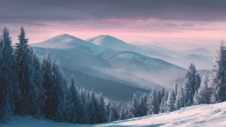 The sunrise melts into soft tones above pristine snowy mountains.の写真素材