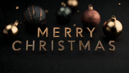 Merry Christmas and Happy New Year. Golden text on dark background with Christmas baubles.の写真素材
