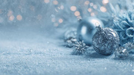 Bright winter Christmas background with white snow texture, falling snowflakes, soft blue sky gradient, and airy holiday mood.の写真素材
