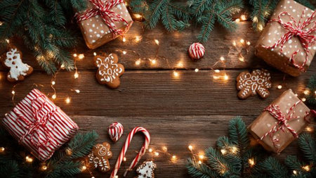 Warm holiday background with glowing lights and dark ambiance.の写真素材