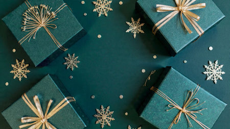 Christmas background with gift boxes and snowflakes on dark green background