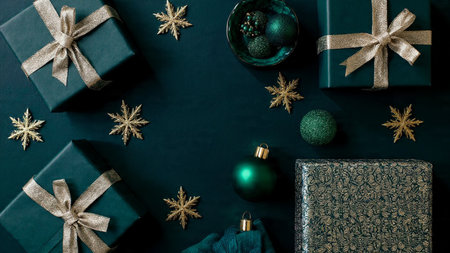 Christmas and New Year background. Gifts and decorations on a black background. Flat lay, top view.の写真素材