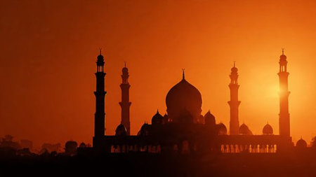 Silhouette of mosque at sunset. Ramadan Kareem background.