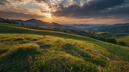 Calm river flowing through lush green valley during soft sunrise glow.