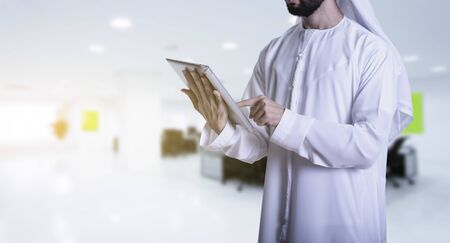 Arab man using tablet in the office - business conceptの写真素材