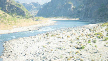 Landscape of the river in the mountains. Shallow depth of field.の写真素材