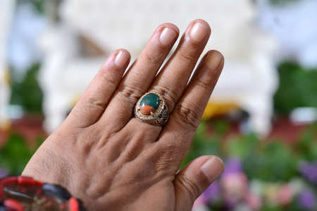 men's jewelery on the fingers, namely rings and agate