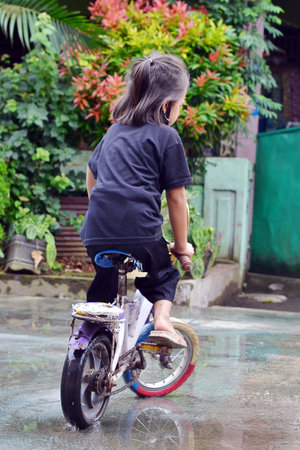 child playing bicycleの写真素材