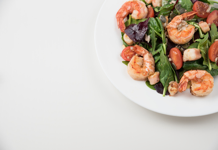 Fresh salad plate with shrimp, tomato and mixed greens. Healthy food. Clean eating.の写真素材