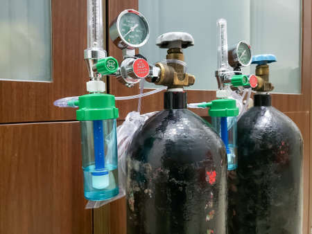 Close up oxygen cylinders for medical equipment that are starting to become scarce because of the patient's needs during the pandemicの写真素材