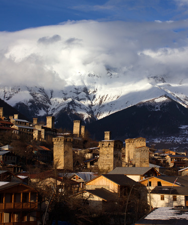 sunny svan towers in Mestia in winter. caucasus, Svaneti, Georgiaの写真素材