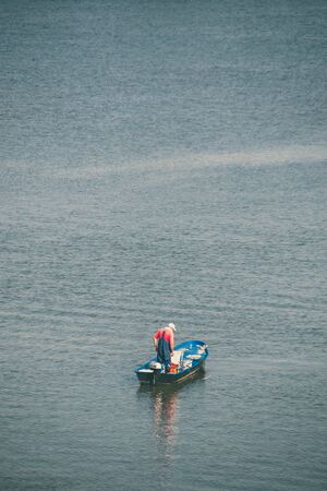 fisherman on the boatの写真素材