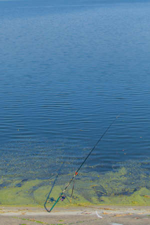 fishing rod on the lakeの写真素材