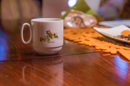 graphic coffee cup on table shallow depth of focusの写真素材