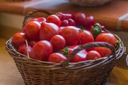 a basket filled of vibrant red tomatoesの写真素材