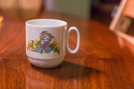 graphic coffee cup on table shallow depth of focusの写真素材