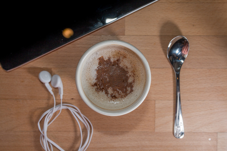 beautiful mug of roasted coffee at officeの写真素材