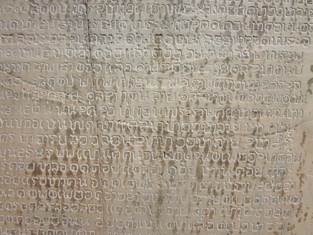 The rune of Thai ancient stone inscription at Sukhothai province, one of Thailand's world heritage, Pattern background close up.の写真素材