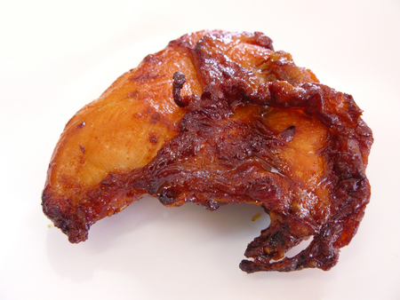 Marinated grilled healthy spicy chicken cooked, Close up view photography, isolated on white backgroundの写真素材